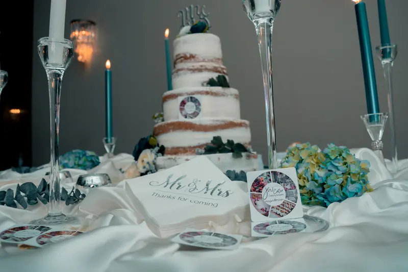 Wedding cake with a Mr and Mrs topper and thank-you card