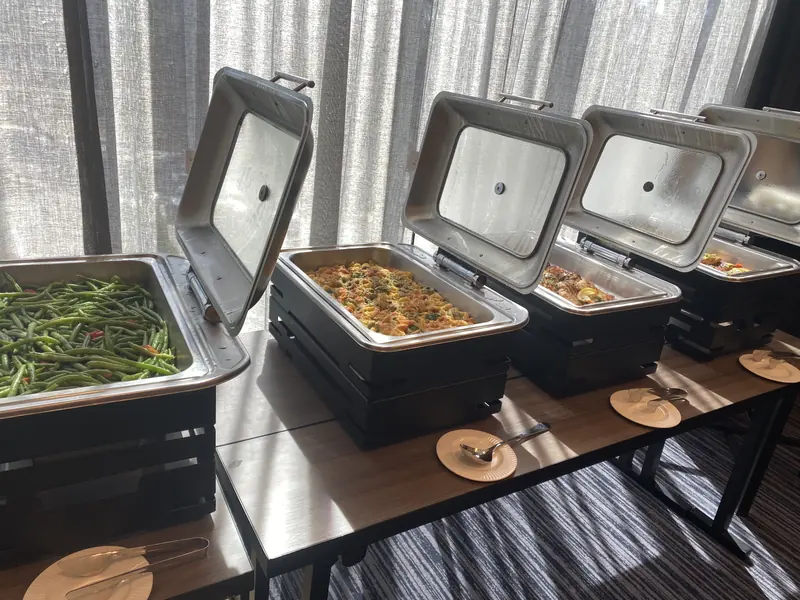 Open chafers with hot food ready for service