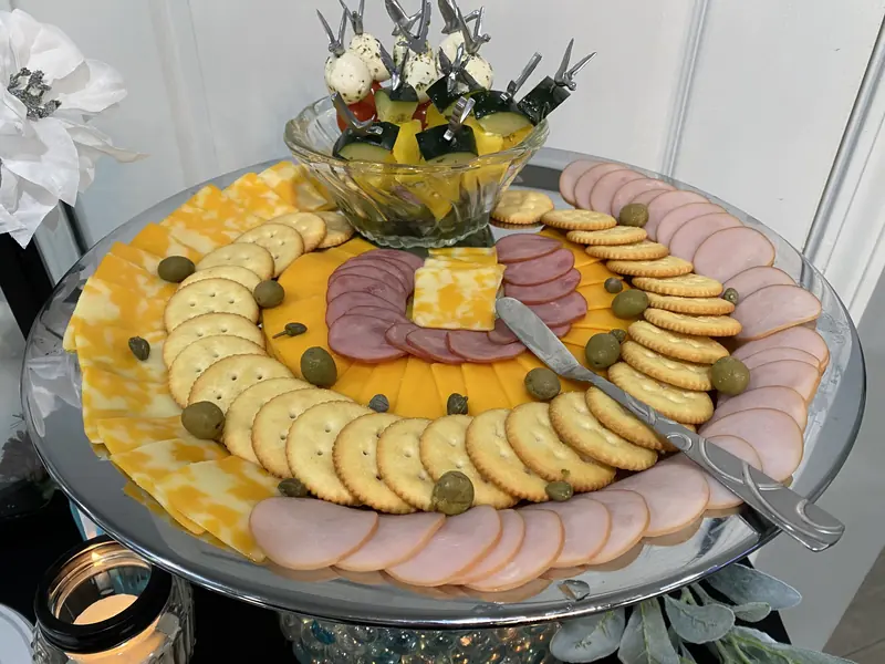Cold cuts and cheese platter with crackers and olives