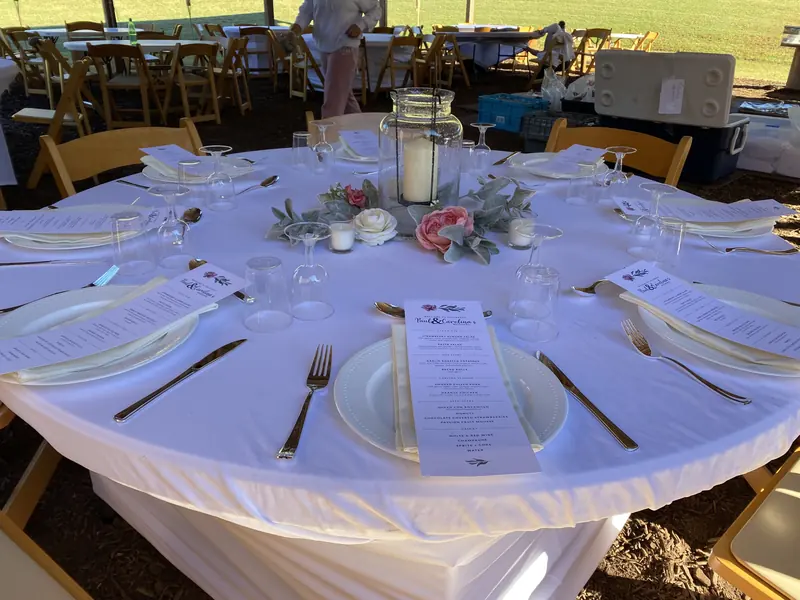 Pavilion table with printed menus and candles