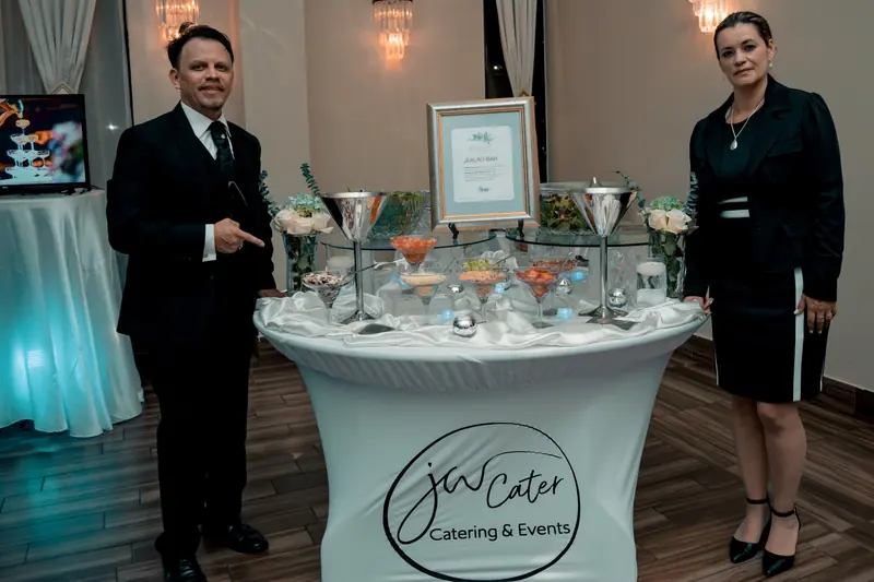 John William and Johana Godoy, founders of JW Cater, beside their salad bar