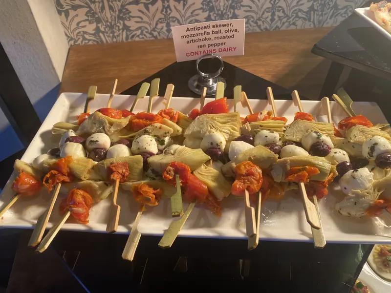 Caprese and vegetable skewers on a long platter