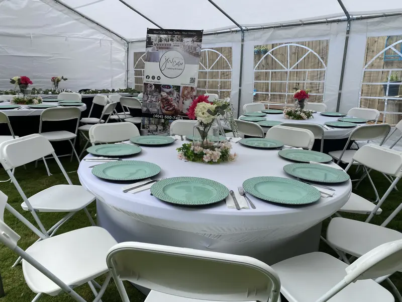 Tent reception tables with green chargers